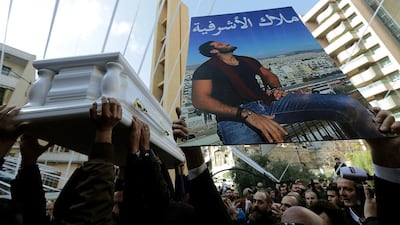 Relatives of Lebanese victim Elias Wardini carry his coffin during his funeral in Beirut on January 3, 2017. Joseph Eid/AFP