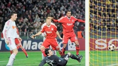 Europol says a Uefa Champions League match in 2009 between Hungarian side Debrecen, in white, and Liverpool was fixed. Vukasin Poleksic, the Debrecen goalkeeper on the night, was handed a two-year suspension by Uefa for not reporting match fixing activities involving another game. Tibor Illyes / AP Photo