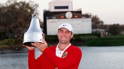 Scottie Scheffler is awarded the championship trophy after winning the Arnold Palmer Invitational golf tournament. Reuters