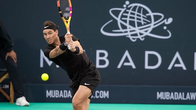 Rafael Nadal hits a shot to Denis Shapovalov during their third-place playoff at the Mubadala World Tennis Championship at Zayed Sports City, Abu Dhabi on Saturday, December 18, 2021. Victor Besa / The National