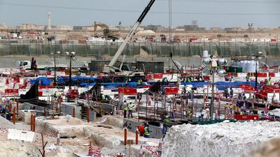 The Al Wakrah football stadium, one of the Qatar’s 2022 World Cup stadiums. Among the major infrastructure projects being built are Doha New Port, a metro system and regeneration of parts of the capital. Marwan Naamani /AFP