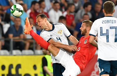 Russia's Sergei Ignashevich, left, is old and too slow, while his fellow defenders lack experience. AFP