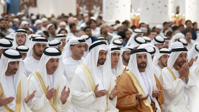 Sheikh Mohammed bin Zayed, third left, attends Eid Al Fitr prayers at Sheikh Zayed Grand Mosque. Seen with, from left, Sheikh Saeed bin Zayed, Abu Dhabi Ruler's Representative; Sheikh Hazza bin Zayed, Vice Chairman of the Abu Dhabi Executive Council; Sheikh Saif bin Mohammed; and Sheikh Suroor bin Mohammed. Eissa Al Hammadi for Crown Prince Court - Abu Dhabi