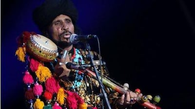 The Sufi musician Sain Zahoor performs at the Abu Dhabi Corniche last night on the closing day of the Womad festival.