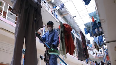 A worker sweeps the floor of the the Arabtec labor camp in Jebel Ali, Dubai. Paulo Vecina/the National