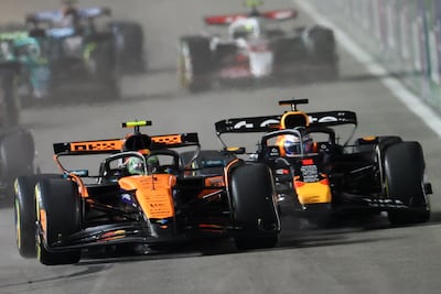 McLaren's Lando Norris, left, under pressure from Red Bull's Max Verstappen at the start of the race. AFP