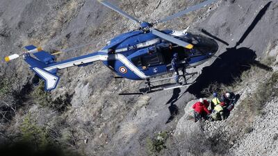 Search workers are deployed by helicopter at the crash site of the Germanwings Airbus A320, to collect debris and find the second black box, above the town of Seyne-les-Alpes, southeastern France on March 29, 2015. Yoan Valat/EPA