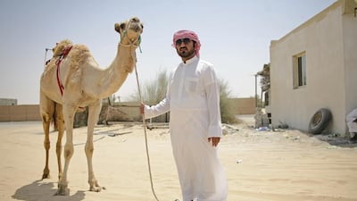 Butti Al Kitbi on his farm with one of his camels, just north of Dubai. His family is known for breeding camels. Lee Hoagland / The National