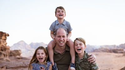 The Duke of Cambridge with his children, Prince George, right, Prince Louis and Princess Charlotte, in Jordan in 2021. PA