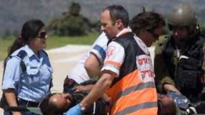 An injured pro-Palestinian activist is evacuated to a hospital in Jerusalem.