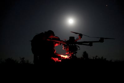 Ukrainian troops prepare a Kazhan heavy combat drone before flying it over Russian zones. Via Reuters