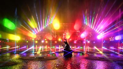 Lights illuminate the Palm House during a photocall at Kew Gardens in south west London, on November 19, 2021, to preview their "Christmas at Kew" light show event - The Christmas at Kew trail is illuminated with numerous light-art installations especially commissioned, an is set to run until January 9, 2022. (Photo by JUSTIN TALLIS / AFP)