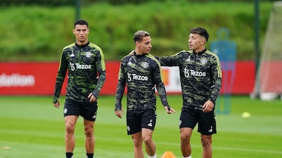 Cristiano Ronaldo, Antony and Lisandro Martinez at the Aon Training Complex in Manchester. PA