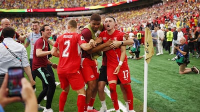 Switzerland's Ruben Vargas celebrates with teammates after scoring a penalty to win the penalty shootout against Colombia, in Vancouver. Reuters