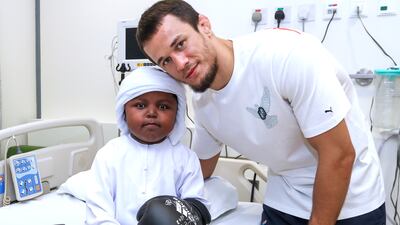 Usman Nurmagomedov with Mohamed Abdul Aziz at the Al Jalila Children's Hospital in Dubai.