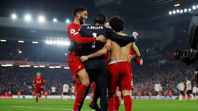 Salah and Alisson are joined by their Liverpool teammates. Reuters