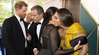 Prince Harry chats with Disney chief executive Robert Iger as Meghan, Duchess of Sussex embraces Beyonce Knowles-Carter at the premiere of 'The Lion King' at Odeon Luxe Leicester Square on July 14, 2019 in London, England. Getty Images