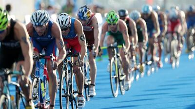Javier Gomez Noya, third left, battled with illness before racing at the Ipic World Triathlon Abu Dhabi. Christopher Pike / The National