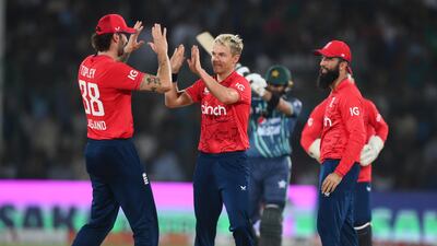 Sam Curran celebrates with Reece Topley and Moeen Ali after dismissing Iftikhar Ahmed. Getty