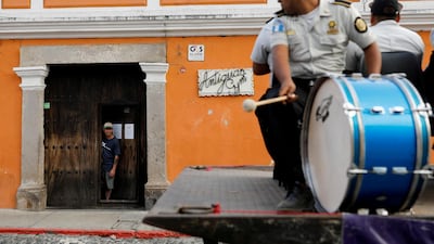 The police musical band performs for the people on a street, as the coronavirus disease (COVID-19) outbreak continues, in Guatemala City, Guatemala. REUTERS