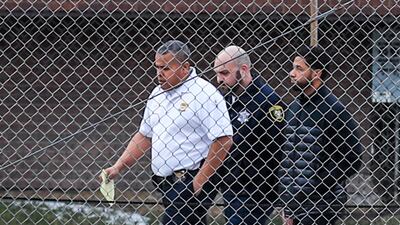 Smollett is seen walking with police with his hands in his pockets. EPA/TANNEN MAURY