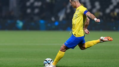 Cristiano Ronaldo shoots at goal during the game against Al Shabab. AFP