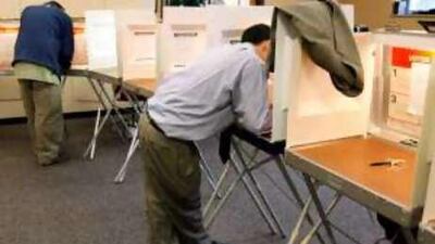 A man marks his ballot during early voting in Boulder, Colorado.