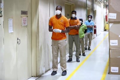 Labourers are screened for Covid-19 at BMJ industries in Ras Al Khaimah. Chris Whiteoak/The National