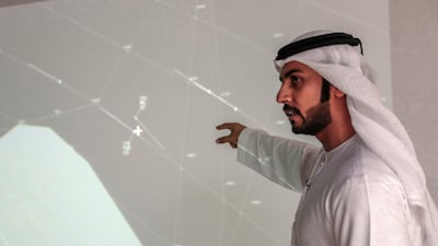 Muayyed Al Teneiji, head of the airspace coordination department at the GCAA, points to a map that captured the moment two fighter jets flew dangerously close to a UAE civil aircraft off the coast of Qatar. Victor Besa / The National