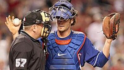 Jarrod Saltalamacchia, playing for the Rangers, argues with Mike Everitt, the home plate umpire, after an error was called.
