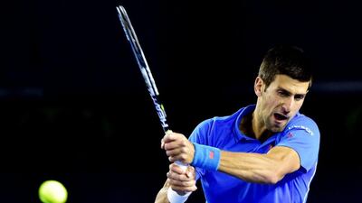 Novak Djokovic returns a shot to Gilles Muller during his fourth round win at the Australian Open on Monday. Julian Smith / EPA / January 26, 2015