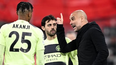 Manchester City manager Pep Guardiola, right, gives instructions to Bernardo Silva, centre, and Manuel Akanji during the Champions League game against Bayern Munich. EPA