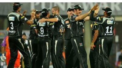 Wayne Parnell, centre, is congratulated by his Pune teammates after dismissing Parthiv Patel.