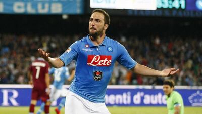 Napoli's Gonzalo Higuain celebrates after scoring during the Italian Serie A football match SSC Napoli vs SS Lazio on May 31, 2015 at the San Paolo stadium in Naples. AFP PHOTO/CARLO HERMANN