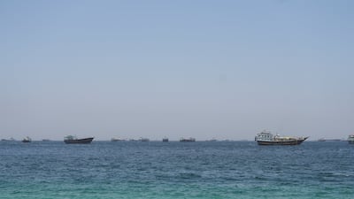 Ships and boats in the Strait of Hormuz as seen from Musandam, Oman, 2026. Reuters