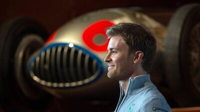 German F1 driver Nico Rosberg of Merceds stands next to a historic race car during a press conference on the occasion of the start of the new racing season in Fellbach, Germany, 11 March 2016. The 2016 Formula One season starts on 20 March 2016 in Australia. EPA/Marijan Murat
