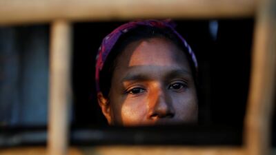 A Rohingya refugee looks out from a shelter at Kutupalong refugee camp near Cox's Bazar, Bangladesh. Adnan Abidi / Reuters