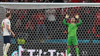 Denmark goalkeeper Kasper Schmeichel prepares for England's Harry Kane, left, to take a penalty during the Euro 2020 semi-final. AP