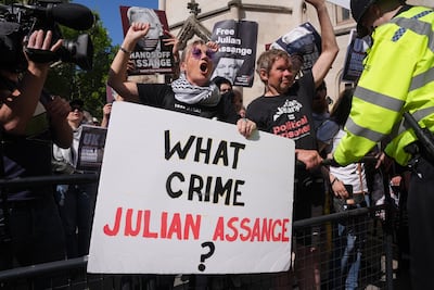 Supporters of Julian Assange outside the Royal Courts of Justice in London before the hearing on Monday. PA