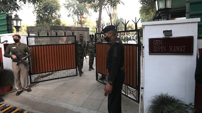Security outside the Chief of Defence Staff Gen Bipin Rawat's residence in New Delhi, India. The Indian Air Force said Gen Rawat, his wife Madhulika Rawat and 11 others on board died in the accident. EPA
