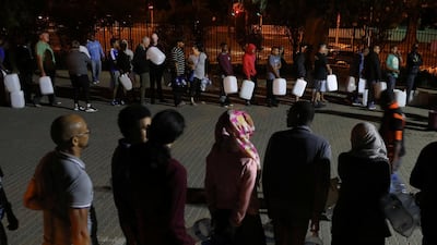People queue to collect water from a spring in the Newlands suburb as fears over the city's water crisis grow in Cape Town, South Africa, on January 25, 2018. Mike Hutchings / Reuters