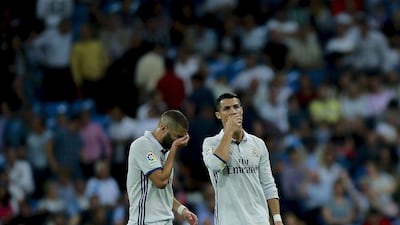 Cristiano Ronaldo, right, of Real Madrid and his teammate Karim Benzema react after Villarreal’s goal. Gonzalo Arroyo Moreno / Getty Images