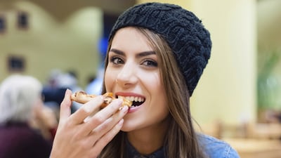 Chewing food slowly helps reduce bloating and aids digestion. iStock