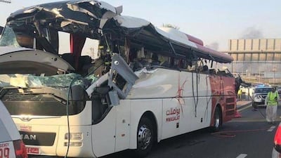 The solid-steel barrier cut through the bus at seat height. Dubai Police