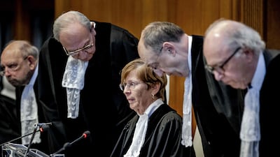 ICJ president Joan Donoghue and judges arrive at the court before the verdict announcement in The Hague on Friday. AFP