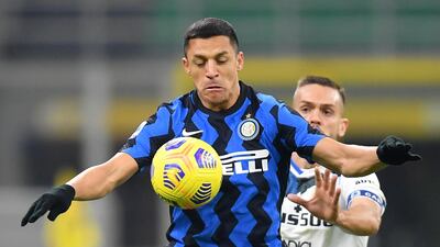 Inter Milan's Alexis Sanchez in action with Atalanta's Rafael Toloi. Reuters