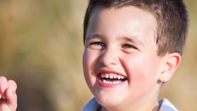 Sam Ray-Elkhodry, 5, suffers from Angelman syndrome, a genetic disorder. A happy demeanour is a core trait of the condition. Courtesy: Em Ray