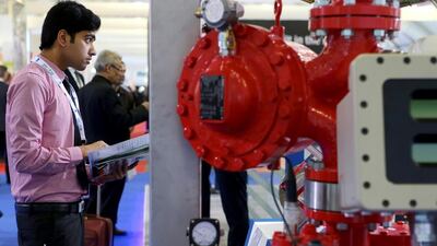 A visitor to Adipec looks at the latest technology on display. Christopher Pike / The National