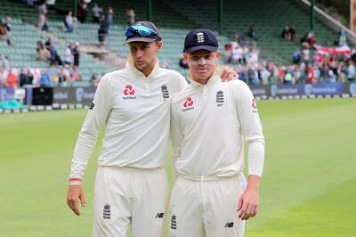 England captain Joe Root, left, hugs Ollie Pope after England's victory over South Africa in the third Test at St George's Park. AFP