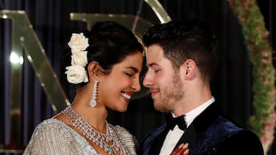 Newlyweds Priyanka Chopra, 36, and Nick Jonas, 26, pose for a photograph during a reception at a hotel in New Delhi on December 4, 2018. Photo: AFP
